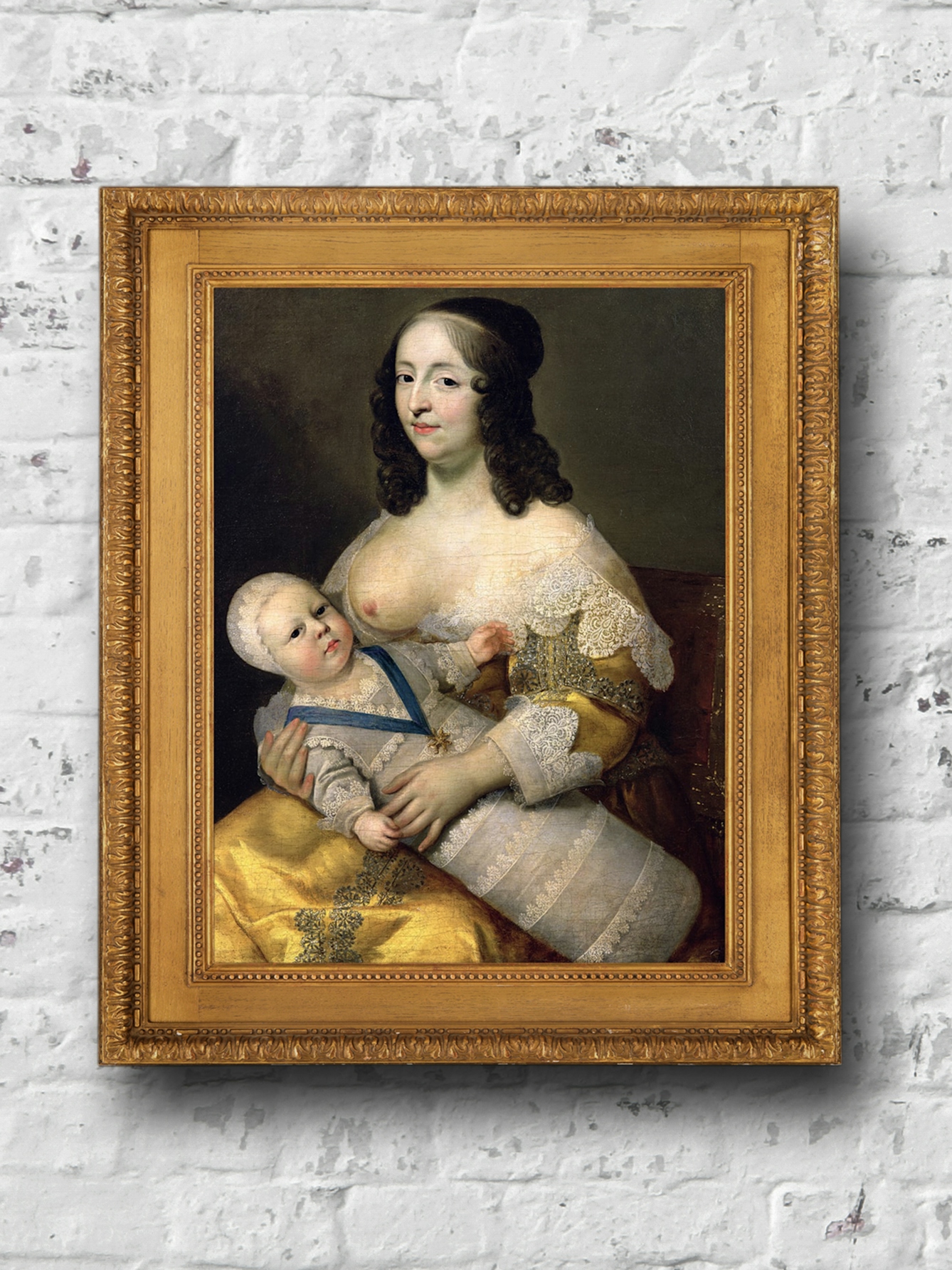 An oil painting depicting Longuet de la Giraudiere acting as a wet nurse for Louis XIV. The child and the women are both looking directly out at the viewer and are dressed in fine clothing with lace trim. The painting is shown in a ngilt frame against a white brick background.