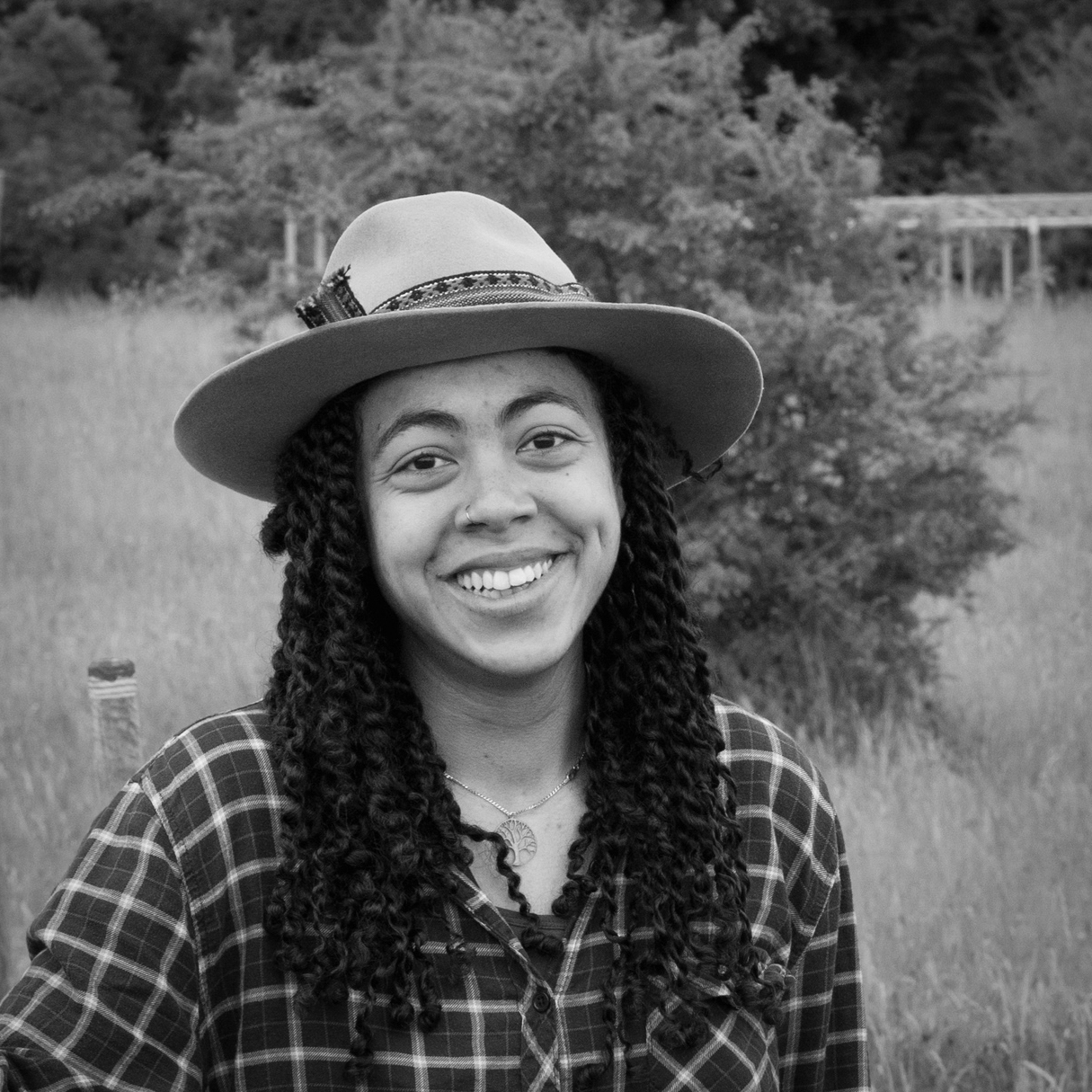 Head and shoulders, black and white photographic portrait of Sara Middleton.