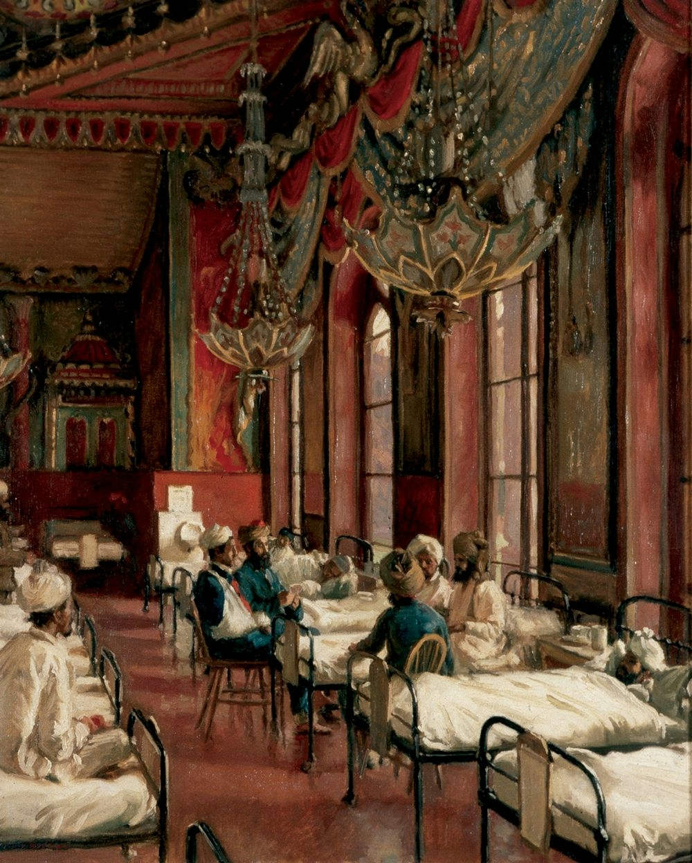 Two rows of beds, occupied by patients, in a highly decorative pink room. A group of patients in chairs are clustered around one of the beds.
