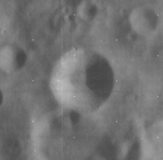A black and white image of a crater on the moon.