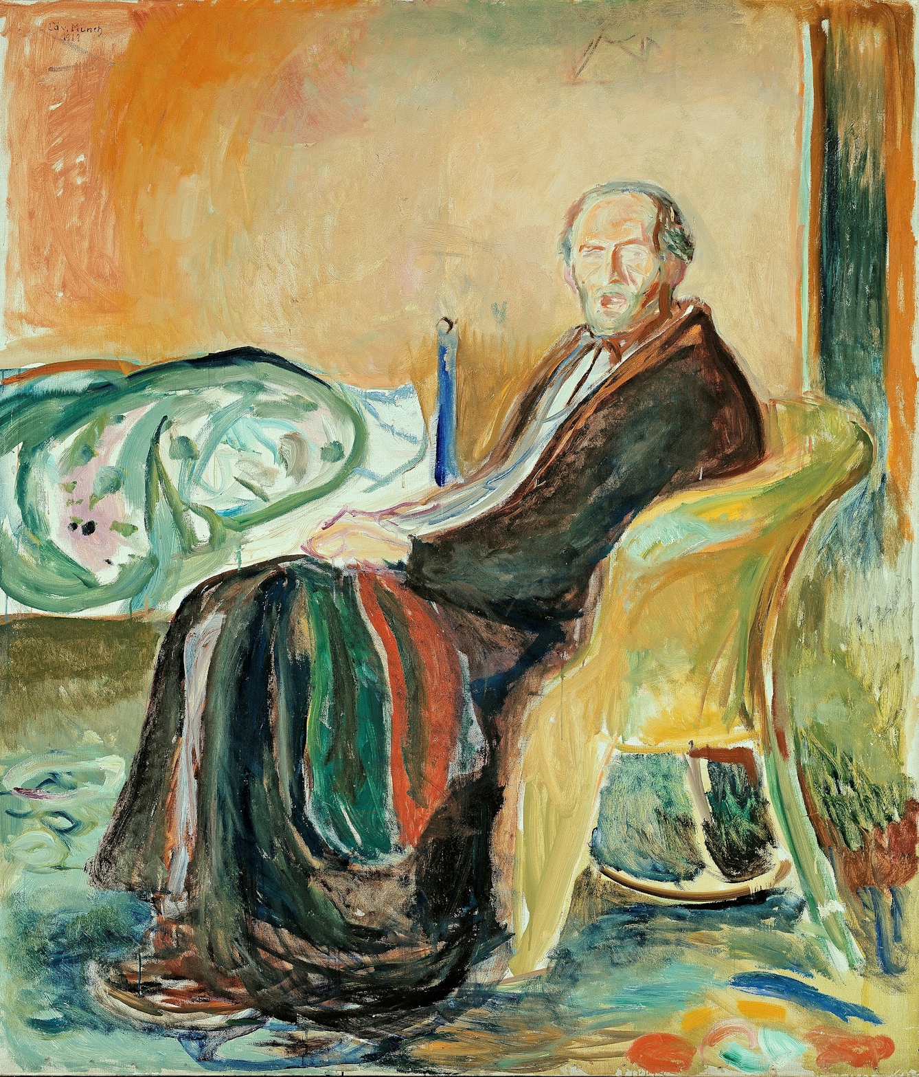 A self-portrait of Edvard Munch sitting in a chair with his bed in the background. 