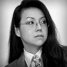 Photographic, black and white, head and shoulders portrait of Sonia Leong.