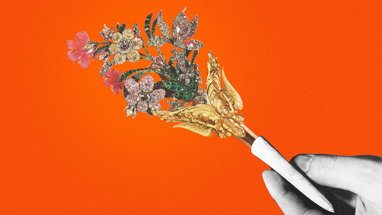 Coloured photograph of a paper collage on a bright orange background. There is a black and white hand in the bottom right holding a colourful and gold piece of jewellery in the shape of a bouquet of flowers.