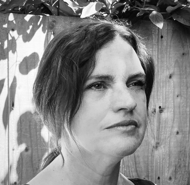 Black and white, head and shoulders portrait of Faye Heller.