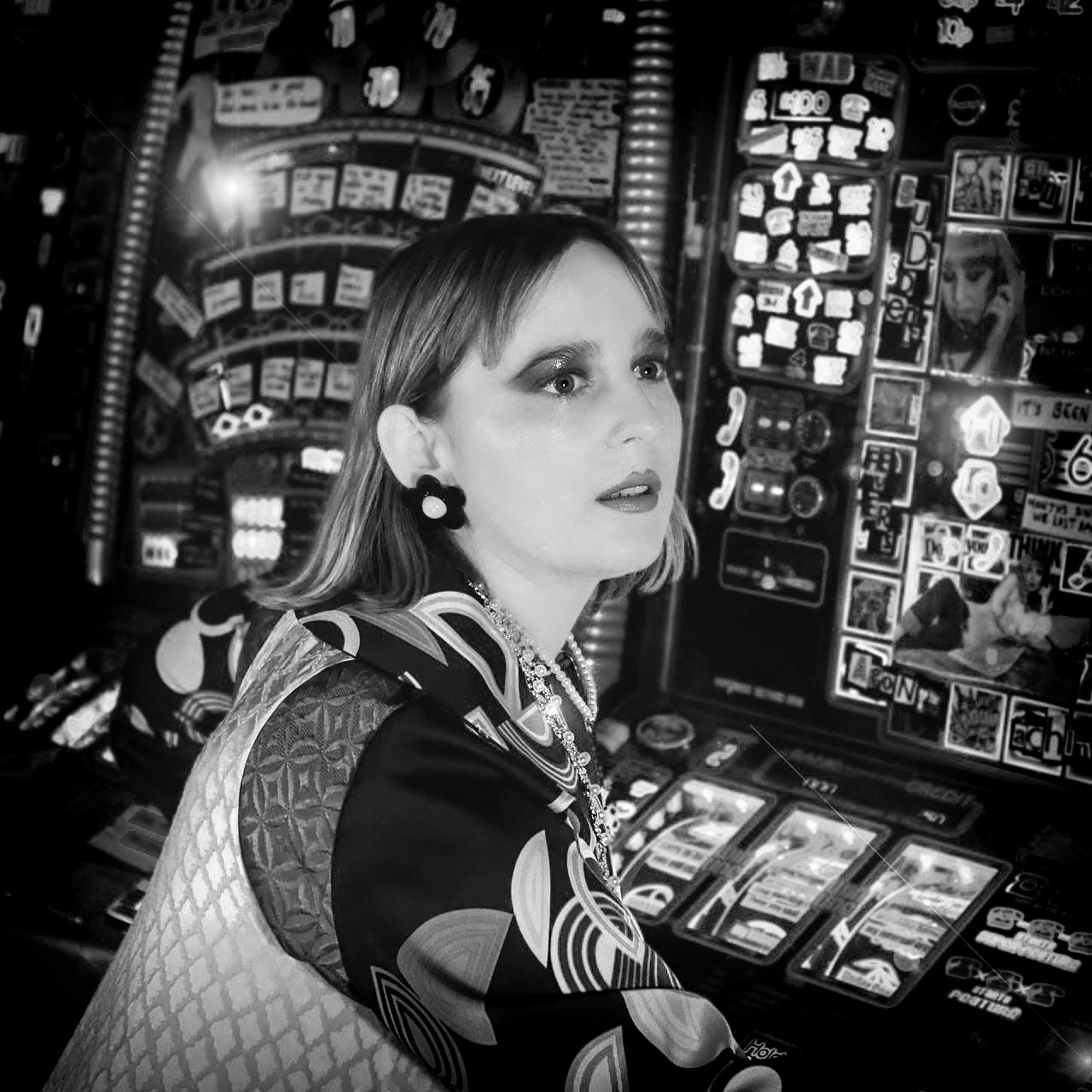 Black and white, head and shoulders portrait of Abi Palmer.