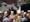 Photograph of a young woman shaking the hand of a man as part of a student graduation ceremony.