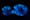 Photograph of the sole of a training shoe which has been treated with luminol to reveal extensive blood traces. These traces show up as bright blue in colour.