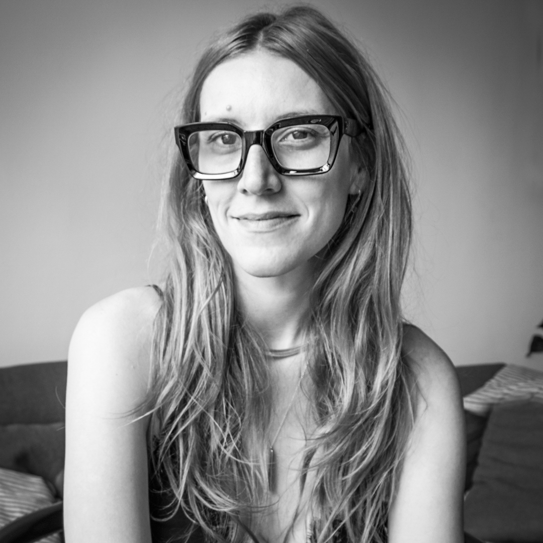 Black and white, head and shoulders, photographic portrait of Carol Nazatto.