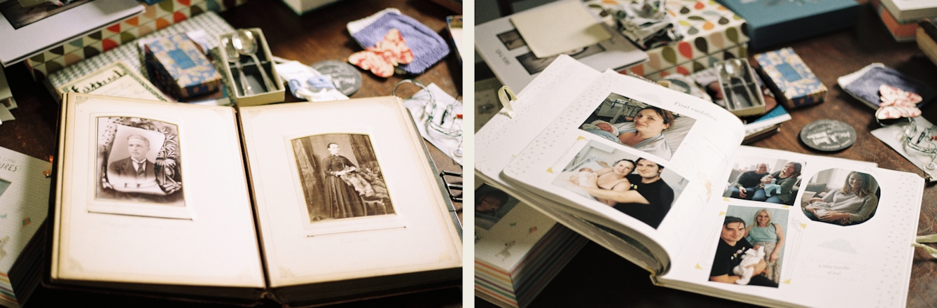 Photographic diptych. Both images show an open family photograph album resting on a tabletop covered in other memorabilia such as loose photographs, small boxes and keepsakes. The image on the left shows an old family album with two sepia prints mounted one on each page. The print on the left page shows a Victorian era man wearing a collar and tie. The print on the right page shows a Victorian era woman standing in a formal studio setting in a long dress. The image on the right shows a modern family album open on a page with several photographs showing the birth of a new baby in hospital and the first time it met its mother, father and wider family.