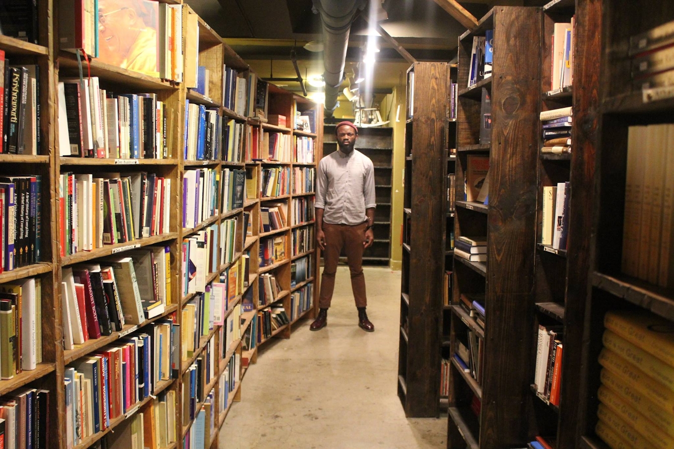 JJ Bola in a library.