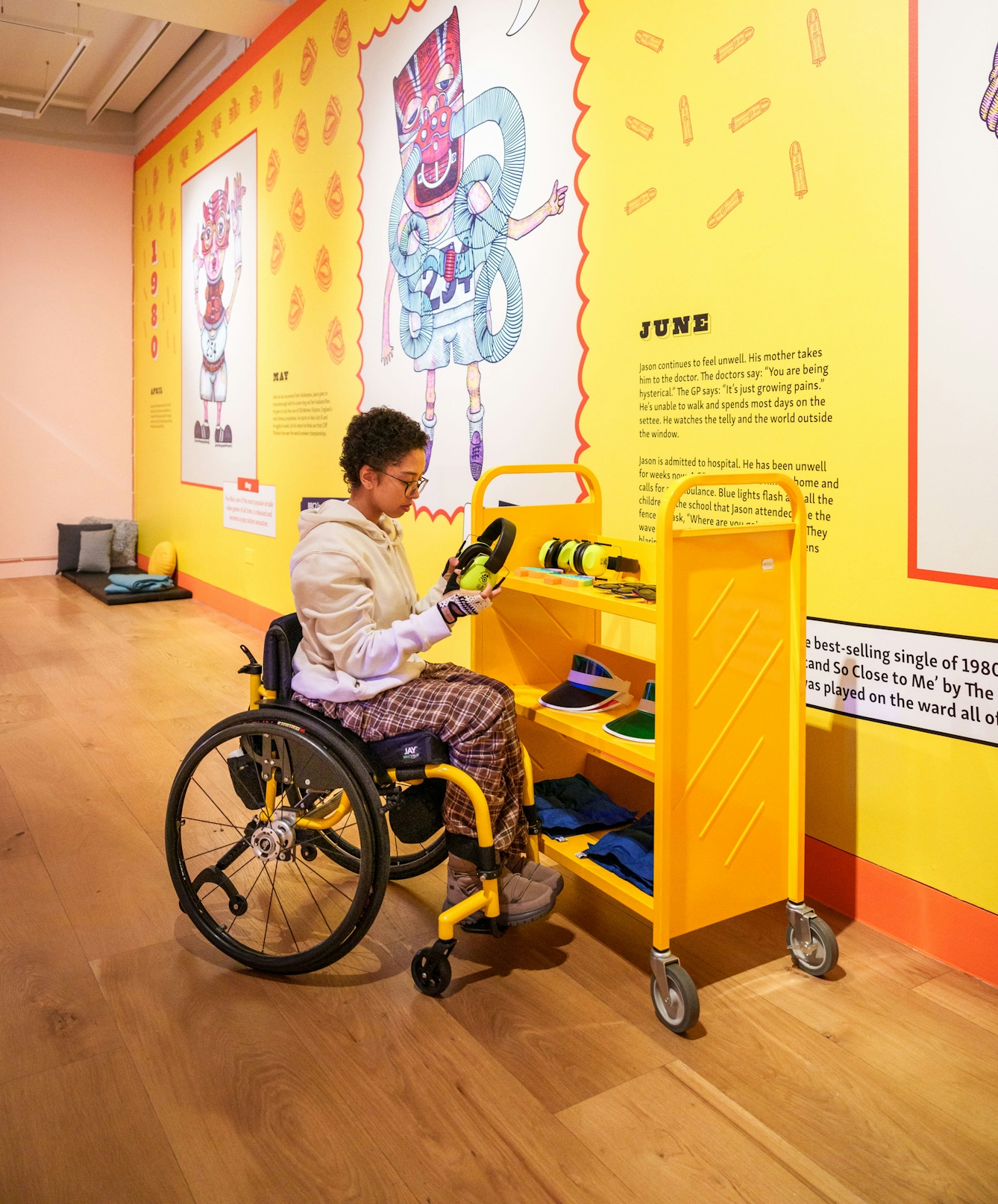 Photo of a person looking at equipment available in a Relaxed Opening of the exhibition.