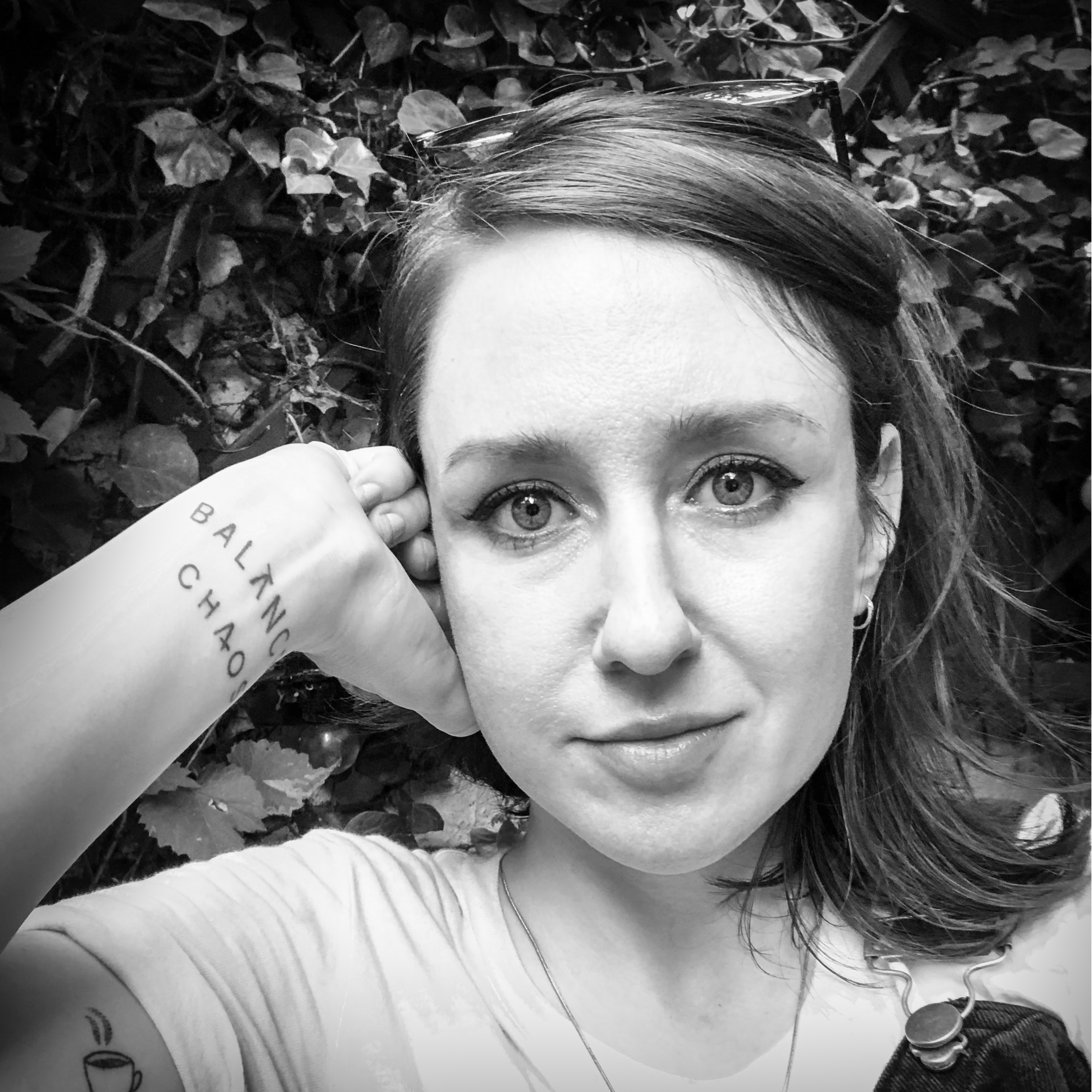 Black and white, head and shoulders portrait of Carrie Ravenscroft.