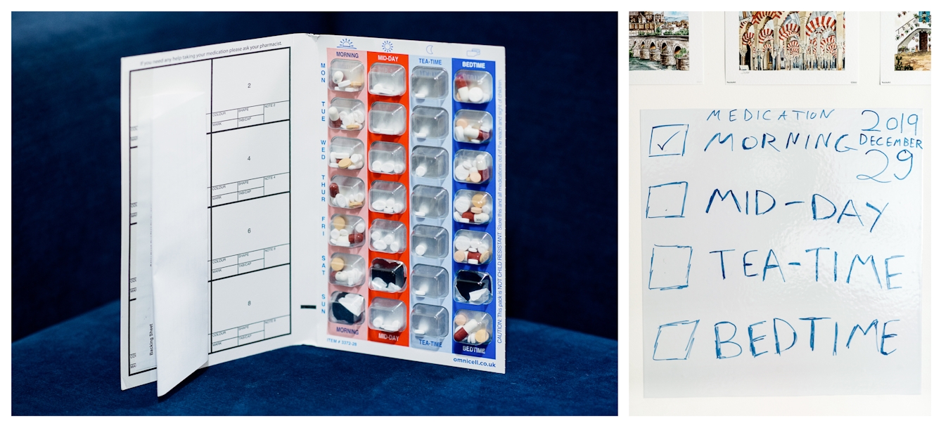 Photographic diptych. The image on the left shows a book type, week medication planner containing a holder for the pills required, morning, mid-day, tea-time and bedtime - Monday to Sunday. The planner is stood on it's end on a blue sofa. The image on the right shows a hand drawn notice on a wipe clean wall sticker with the words, Medicaiton, morning, mid-day, tea-time and bedtime and accompanying check boxes.