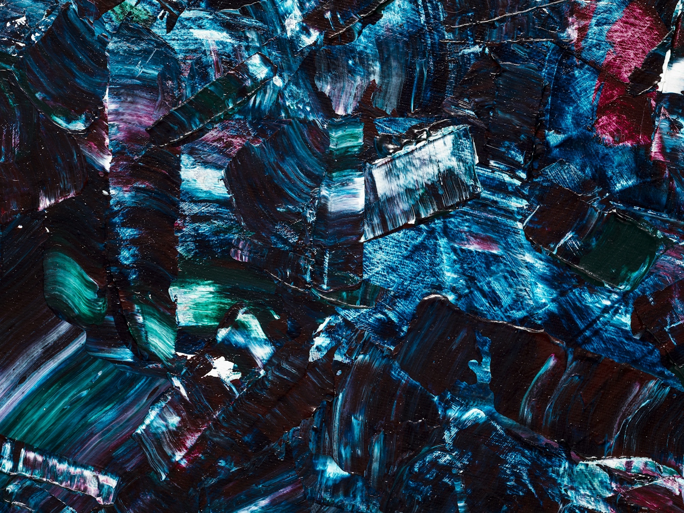 Detail from a larger abstract expressionist painting utilising acrylic paint on a circular canvas, titled 'Dissonant'. This detail is a close crop into he centre of the canvas, filling the frame with colour. The vast majority of the canvas surface contains sharp disconnected marks of blues, purples, turquoise, white and scarlet. The marks are short and random in direction and length. Together they make up a scene of fractured and abrupt expression, yet with a compelling beauty.