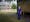 Photographic full length portrait of Ben Silverman, consultant anaesthetist, outside Harefield Hospital, Uxbridge.