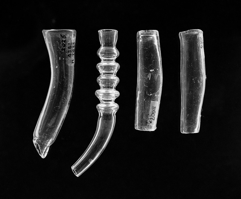 Image of four clear glass tubes.