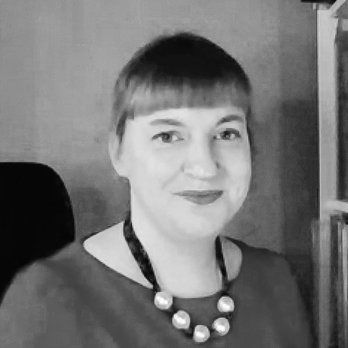 Black and white photographic headshot of Dr Laura Kelly