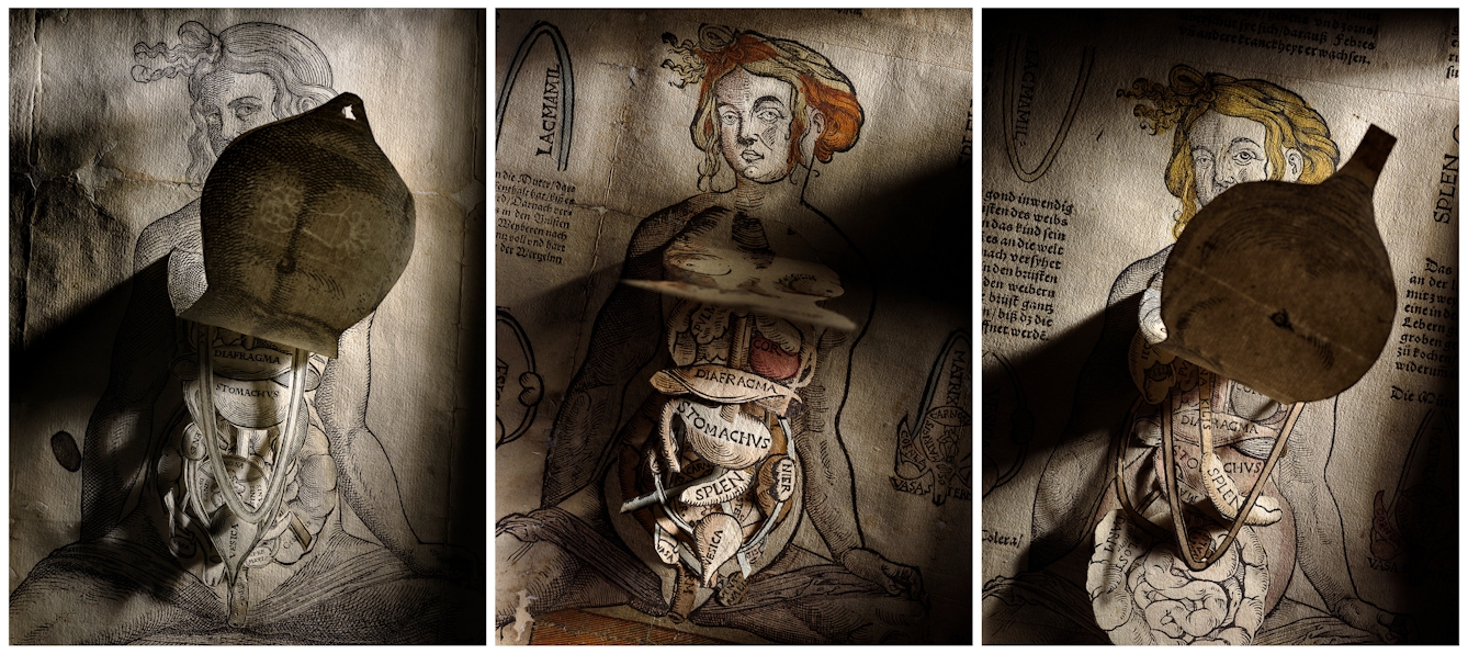 Photographic triptych, each image showing a 16th-century anatomical fugitive sheet. The sheets are made up of a background engraving of a human torso. Over the top of the torso are several layered engraved paper flaps, hinged at the top, one above the other. Each one portrays a different human organ in order of depth within the body: the lungs, intestines, kidneys and so on. The sheet is dramatically lit with a shaft of light casting deep shadows revealing the paper flaps. The face of each engraved woman stares straight out, partially obscured by the initial skin flap, in the images on the left and right.
