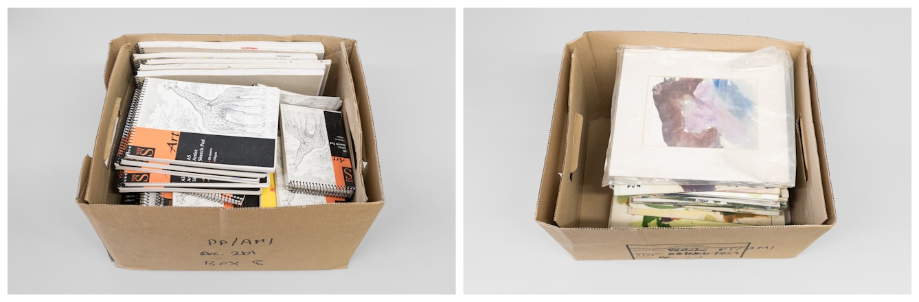 Photographic diptych. Both images show a brown cardboard box, with the lid off resting on a grey tabletop. Inside each box is a stack of spiral bound sketchbooks, piled up to the top edge of the boxes.