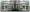 Photographic panorama showing a conservatory attached to back of a brick house. The panorama is mirrored down its vertical centre line except that a small human figure sitting at a table in the conservatory appears in the left half, but not in the right half.
