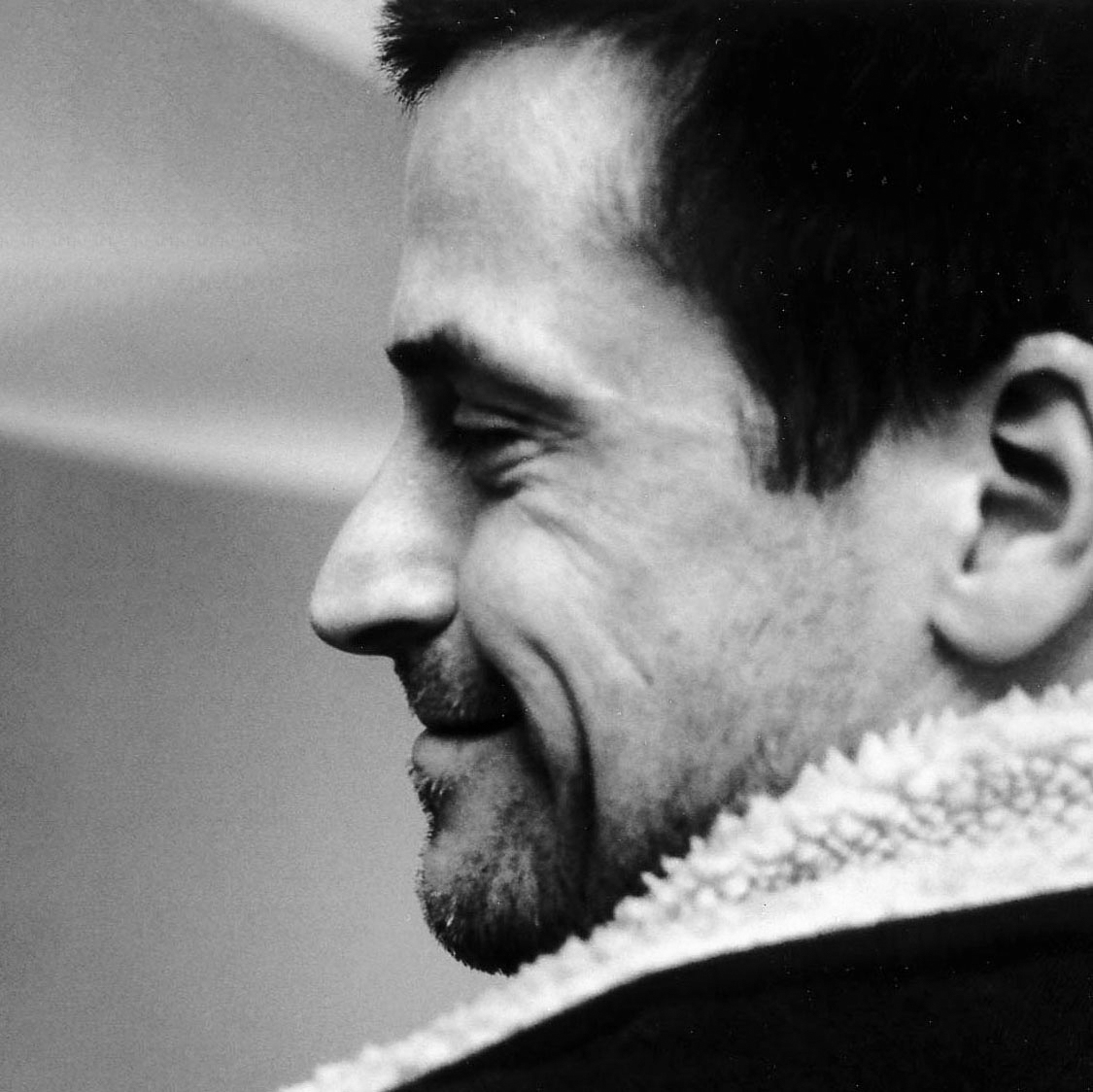 Black and white, head and shoulders, photographic portrait of Tim Robinson.