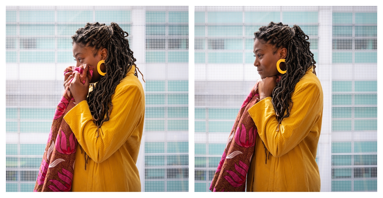 Two photographs side by side of a black women wearing a yellow suit, standing by a large window. In the left image is she is smelling a piece of patterned cloth, in the right image she is holding it tightly.