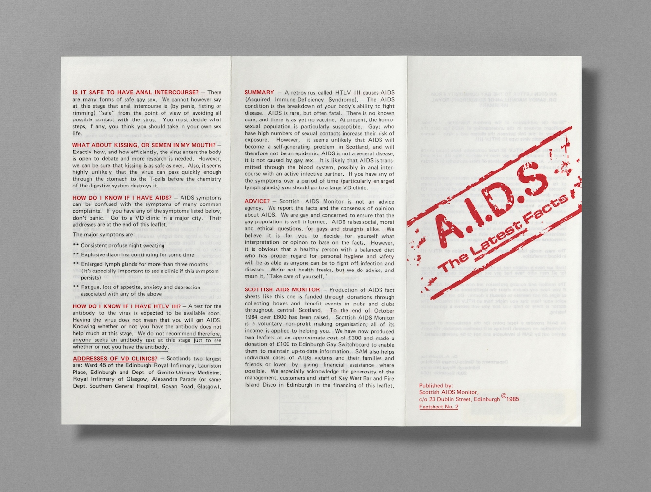 Colour photograph of one folded sheet pamphlet with the red title A.I.D.S The Latest Facts. There is a lot of black text and red subheads including "is it safe to have anal intercourse?" and "How do I know if I have AIDS?" 