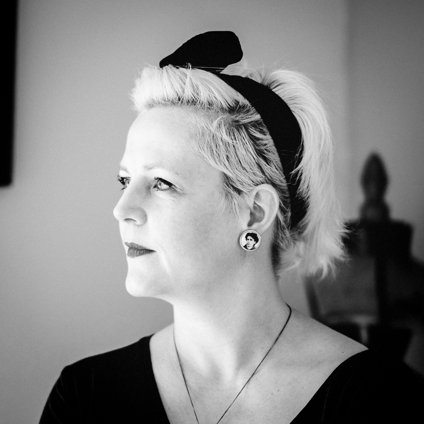 Black and white, head and shoulders portrait of Katy Lemay.