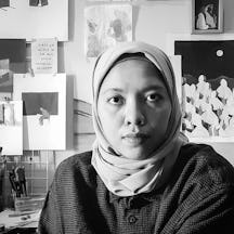 Black and white head and shoulders photographic portrait of Ifada Nisa.