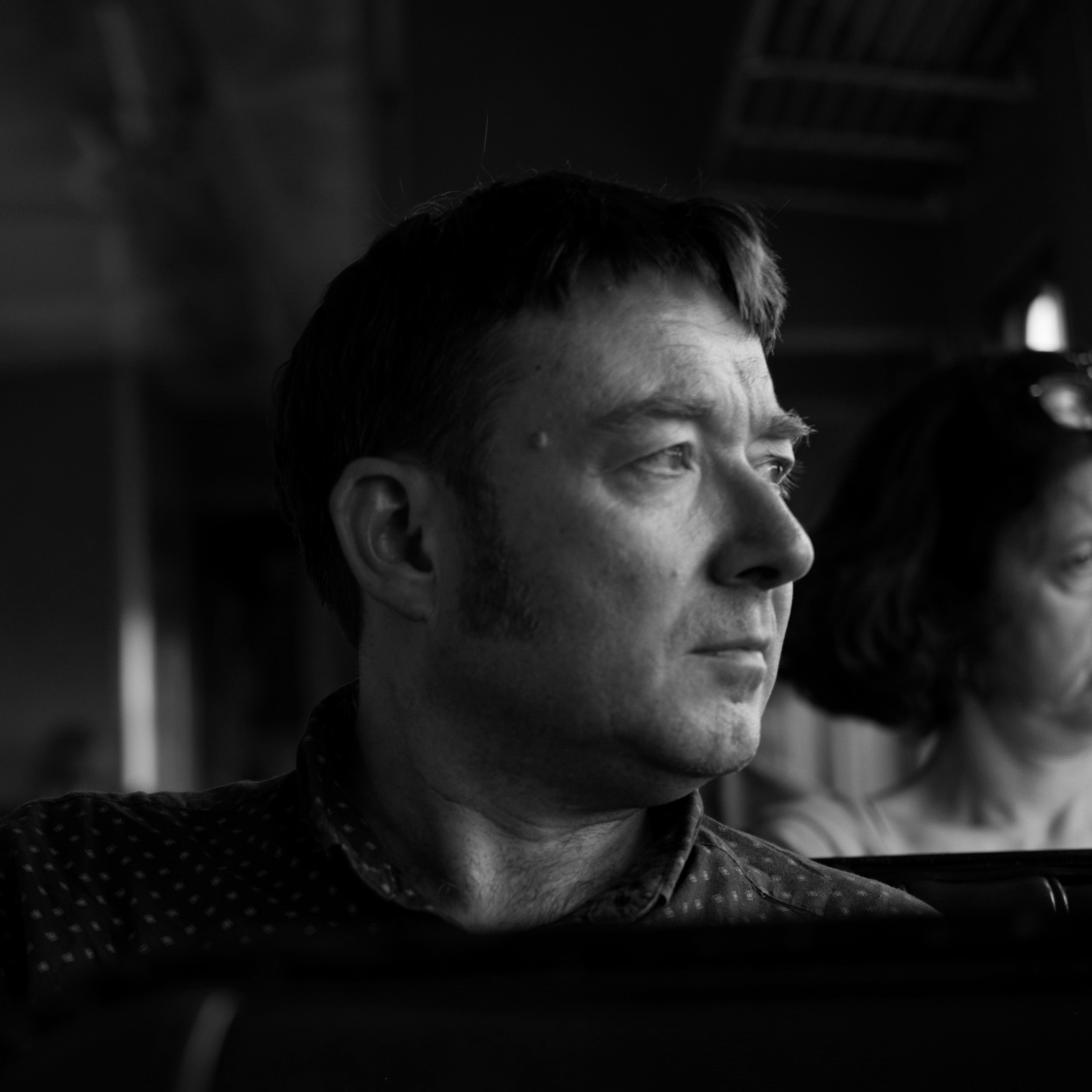 Black and white photograph of Chris Mugan