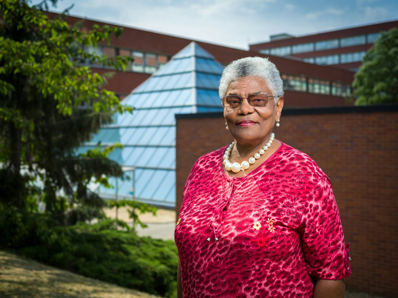 Photographic portrait of Cecilia Brown outside St George's University Hospital, London.