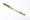A photograph of a luxury gold toothbrush the letter ‘N’ engraved on the handle.