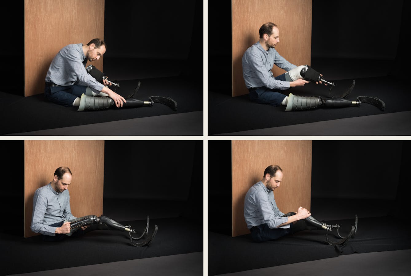 Image made up of four photographs. 

The top left photograph shows Harry Parker wearing a grey shirt and jeans, sat on a black mat on the floor. He has short brown hair and a beard. There is a wood panel behind him. He is slightly bent over and holding his prosthetic limbs. 

The top right photograph shows Harry Parker in the same setting, he is sat up and holding his left prosthetic limb. 

The top right photograph shows Harry Parker in the same setting, he is sat up and holding his left prosthetic limb. 

The bottom left photograph shows Harry Parker in the same setting, he is holding his left prosthetic limb. 

The bottom right image shows Harry Parker in the same setting. His head is bent and he is holding his right prosthetic limb. 