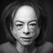 Black and white, head and shoulders portrait of Liz Carr.