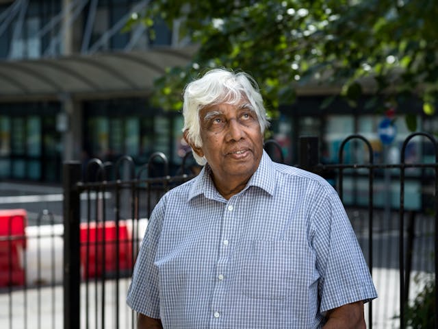 Photographic portrait of Ossie Fernando outside the Royal Free Hospital in London.