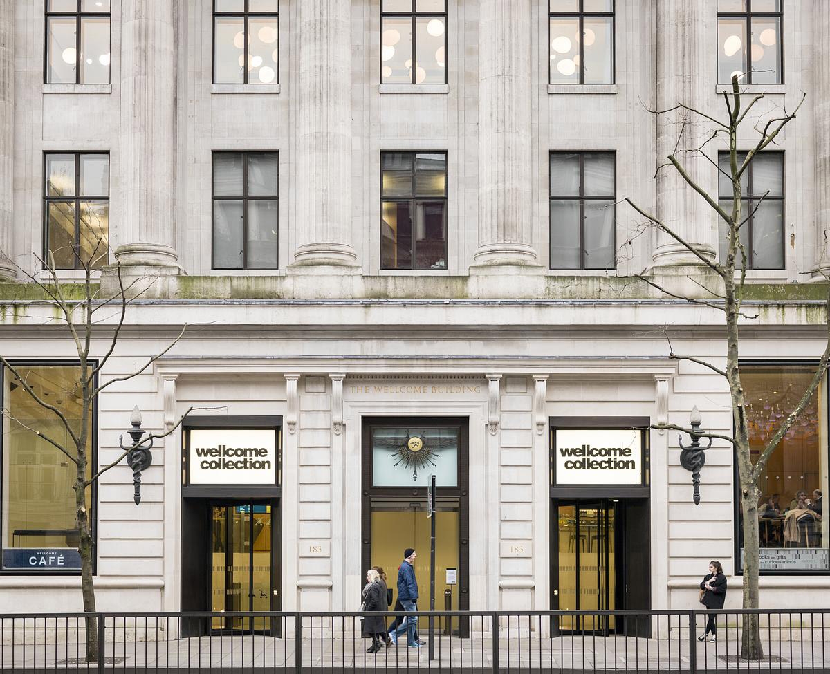 Large white stone building. The entrance to Wellcome Collection museum.