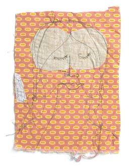 Colour photograph of embroidery with a light patterned background with plain cloth stitched on and the outline of a face with closed eyes overstitched on these layers.
