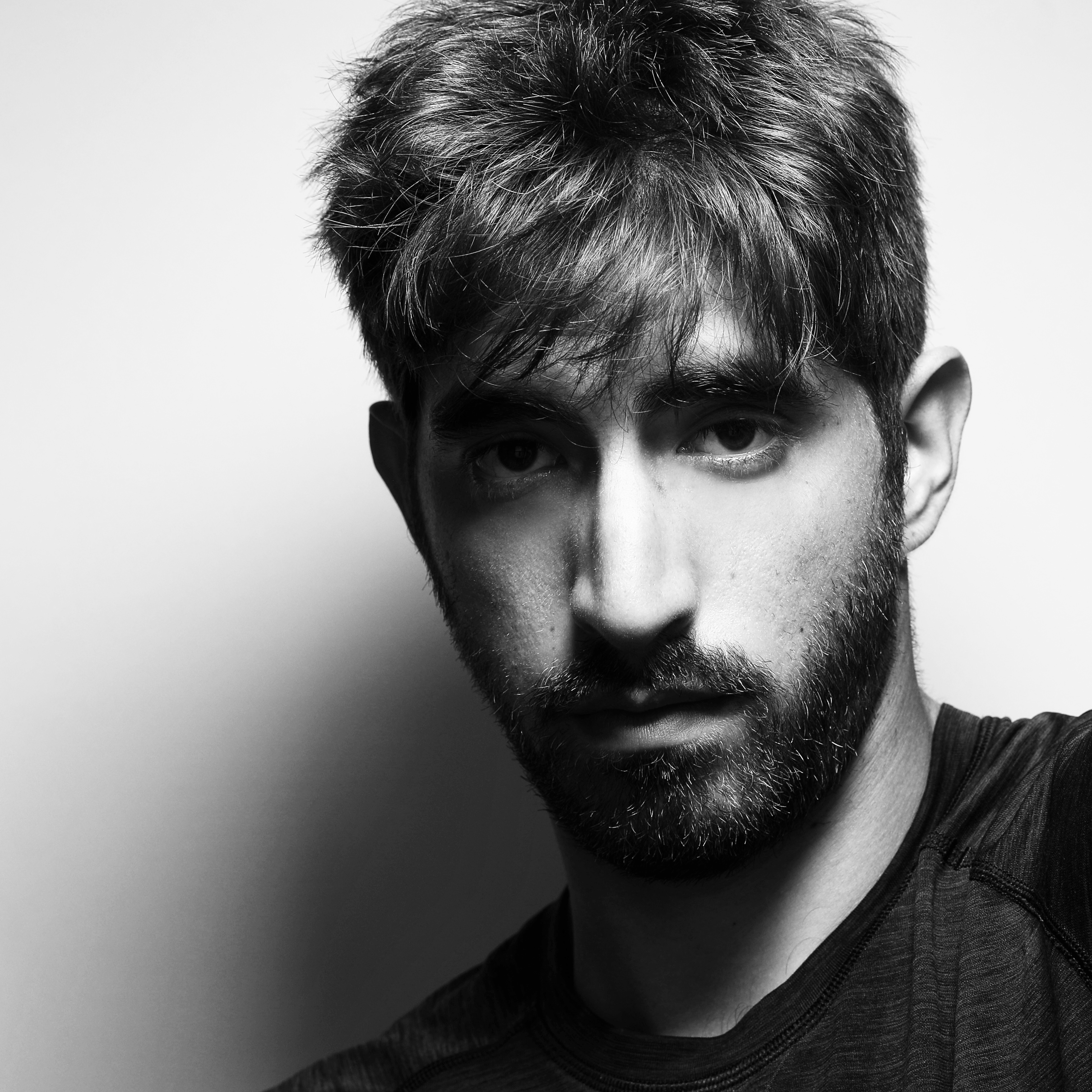 Black and white head and shoulders photograph of Jack Seikaly.