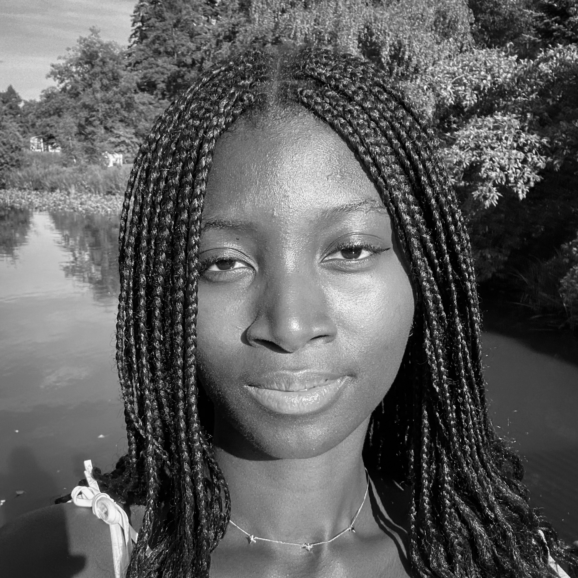 Black and white, head and shoulders, photographic portrait of Funmi Lijadu.