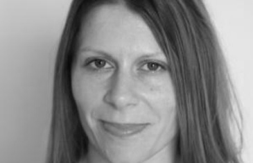 Black and white, head shot of Dr Bonnie Evans.