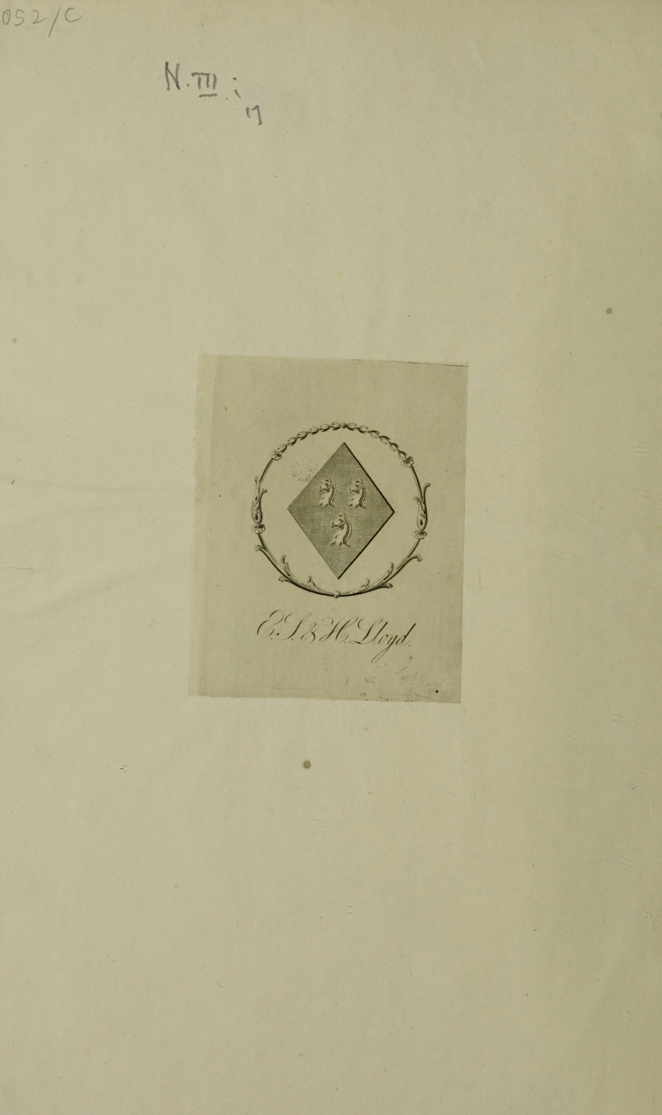 Bookplate depicting a diamond shaped coat of arms with three horses' heads within the circumference of a wreath.  Below the wreath is written 'E.J. & H. Lloyd.' 