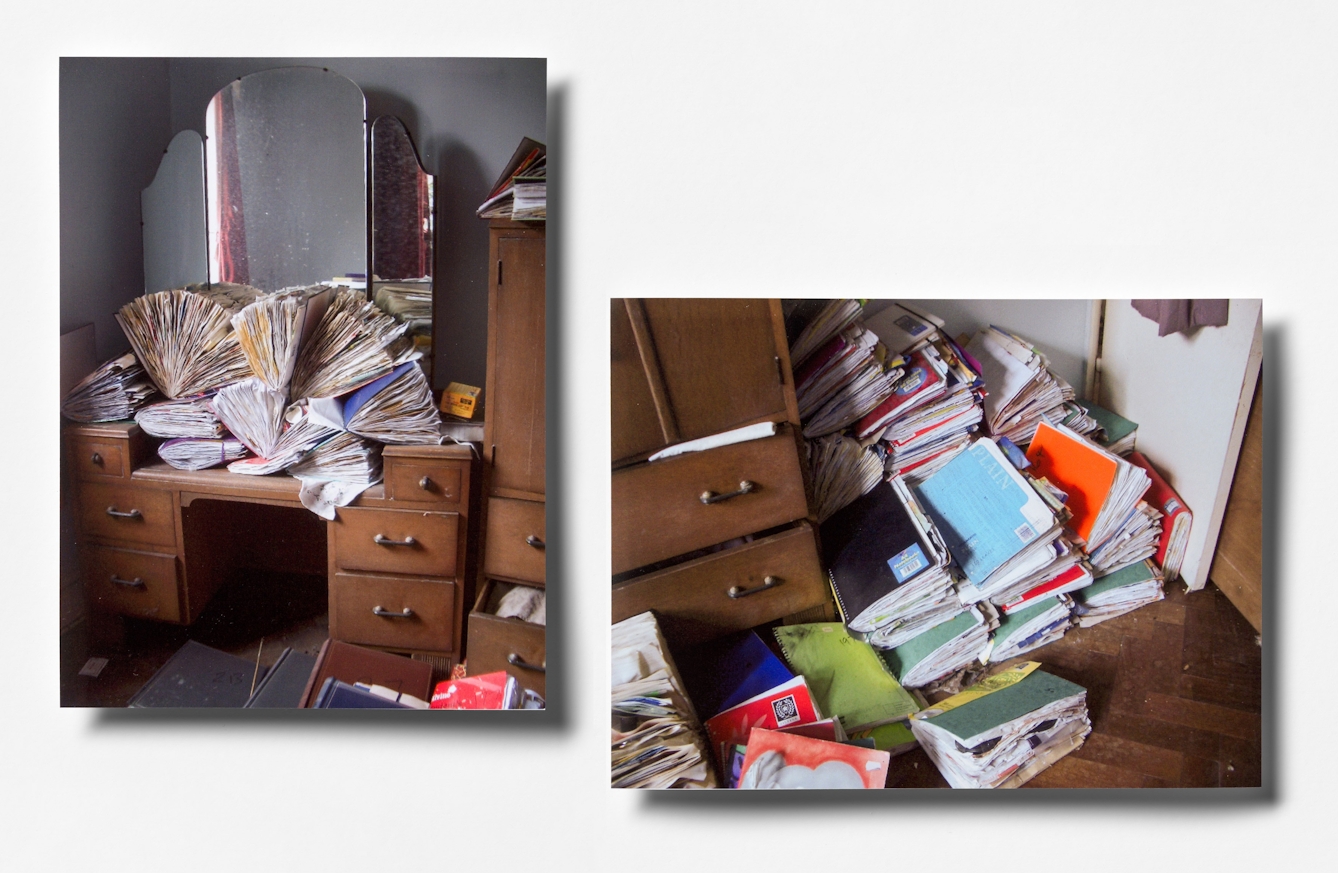 Photograph of 2 colour photographic prints, slightly raised above a white background. Both prints show a scene from a bedroom showing a wooden dressing table. Piled high on the tabletop and on the floor are tens of bulging scrapbooks of varying types, crammed full of stuck in material.