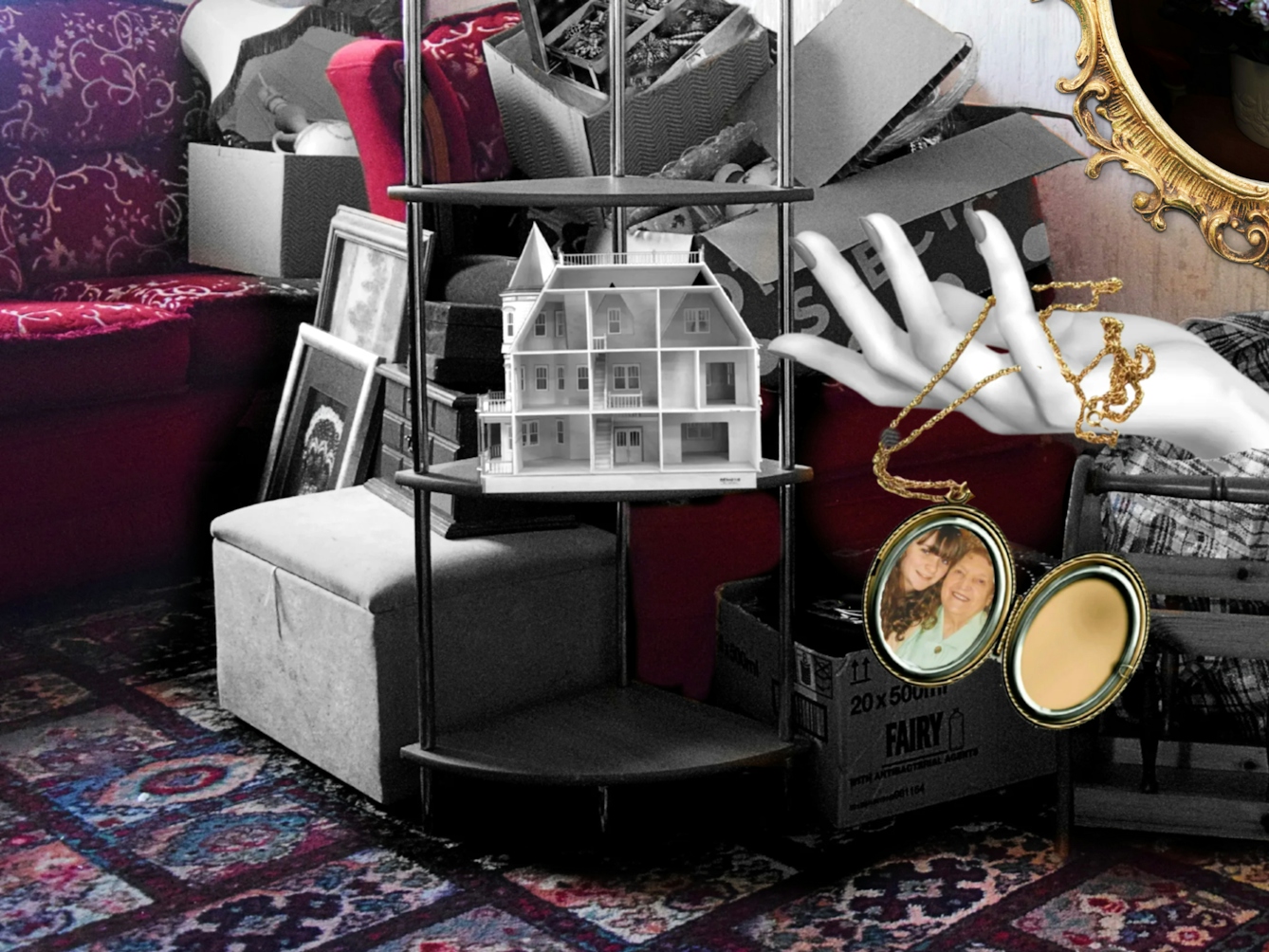 Crop of a larger colourful photograph with some coloured and black and white collage elements. The photo is of an empty living room with patterned off-white wallpaper, a red floral patterned sofa and a patterned carpet. There are pieces of black and white furniture in a pile next to and on top of the red sofa, including lamps, picture frames, storage bags, jewellery boxes and a shelving unit. On the shelving unit is a three story dollhouse which is empty. A black and white mannequin hand is shown coming out of a storage bag, and laced between its fingers is a golden pendant which is open and contains a photo of a girl and her grandma. On the wall is a ornate golden photo frame that contains a photo of a vase of different coloured flowers and a hairbrush. 