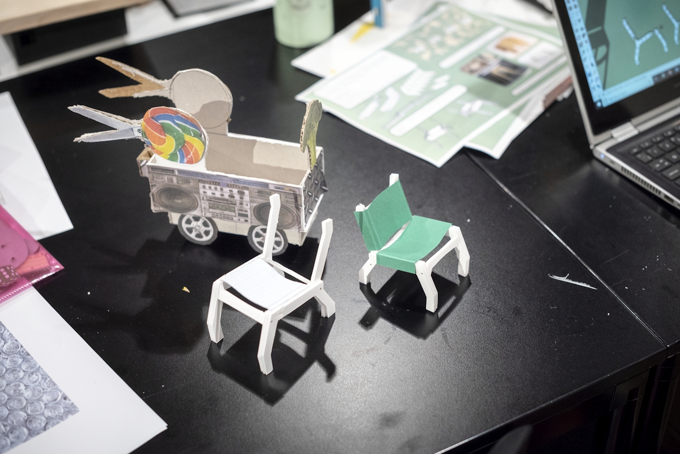 Three miniature prototypes of chairs and musical trolleys