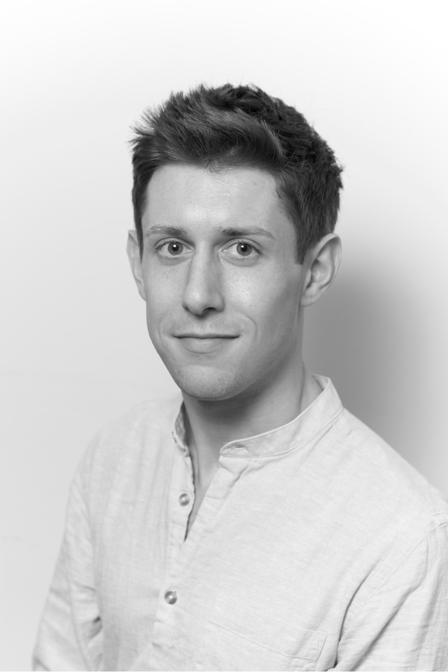 Black and white head and shoulders photo of Guy Stagg