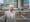Photographic portrait of Morgan David Enoch standing in front of University Hospital of Wales.