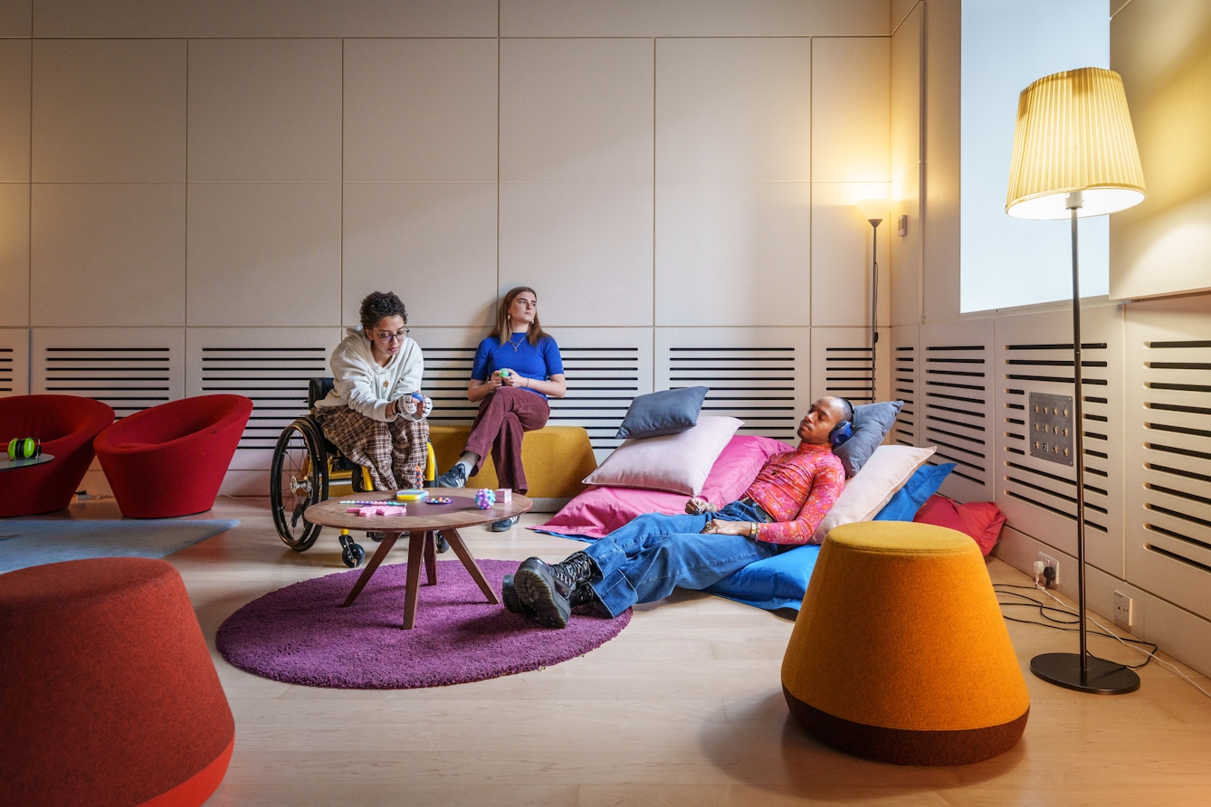 People sitting and lying in the chill-out space at the relaxed opening.