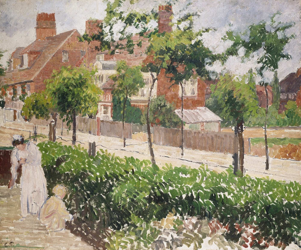 Painting by Camille Pissarro in the Impressionist style of small but visible brush strokes. Shows a road with red-brick houses in the background and leafy green shrubs and taller trees. A women and child dressed in white and beige tend to the greenery in the foreground.