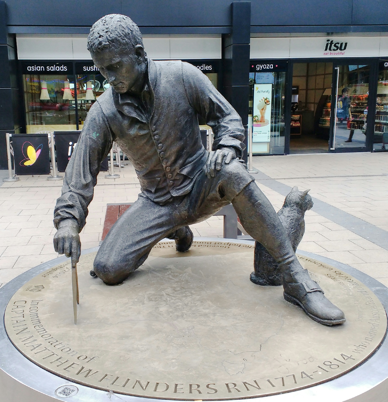 Colour photograph of the statue of Matthew Flinders outside Euston Station