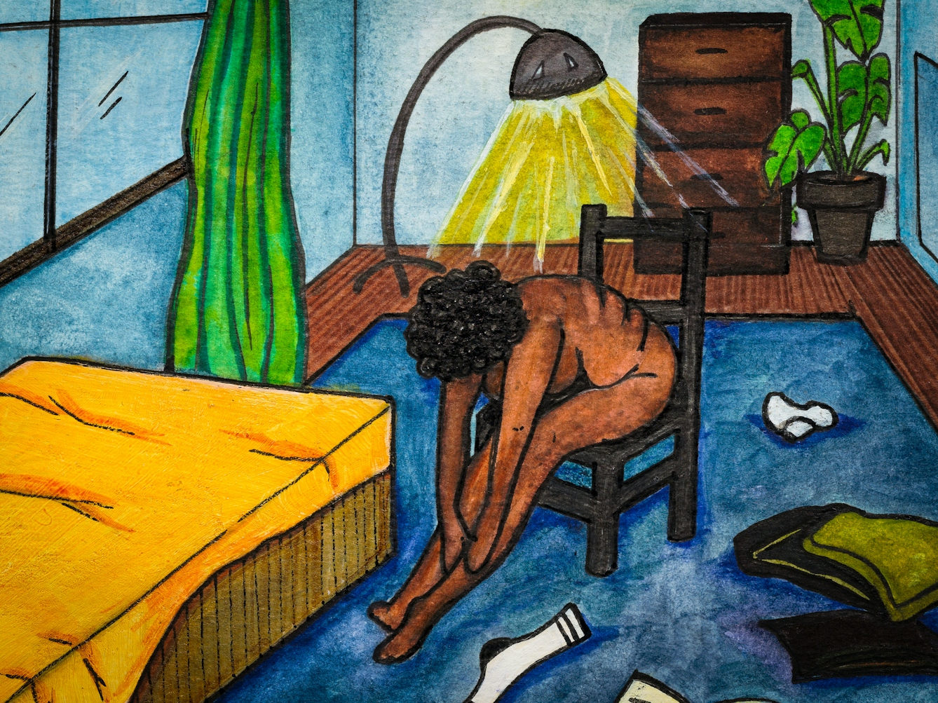 Detail from larger artwork made with paint and ink on textured watercolour paper. The artwork shows a scene in a bedroom with predominantly hues of blues, greens and yellows. To the left is a single bed on the blue carpet. Sat next to the bed on a chair is a naked Black woman. In front of her on the floor is a sock, an open book and pillows. She is stretched forward with her hands near her ankles. Her head is bowed obscuring her face. 